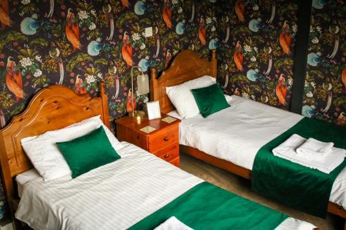 Ένα ή περισσότερα κρεβάτια σε δωμάτιο στο Waverley B & B