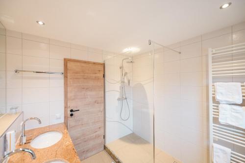 a bathroom with a shower and a sink at Hotel Goldener Engel in Ihringen