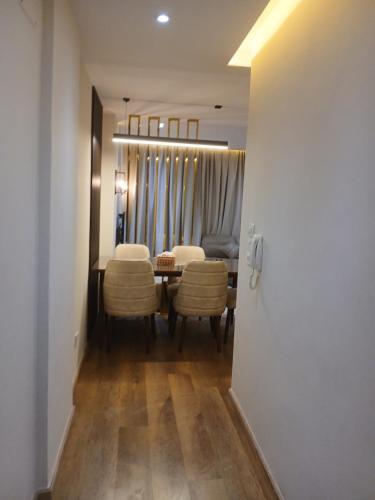 a dining room with a table and chairs at Dar Residence - Madinaty B12 - U2 - 2 BR - New Cairo in Madinaty