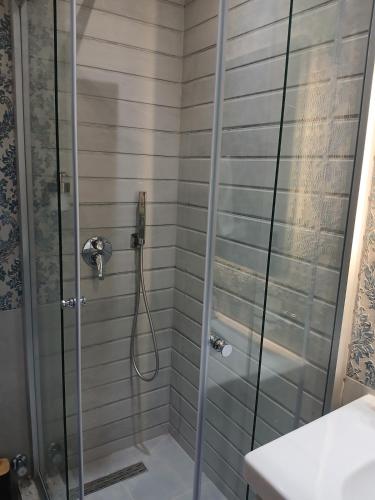 a shower with a glass door in a bathroom at Dar Residence - Madinaty B12 - U2 - 2 BR - New Cairo in Madinaty