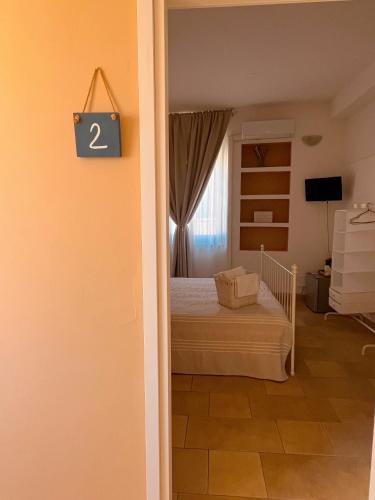Postel nebo postele na pokoji v ubytování Regina Margherita B&B
