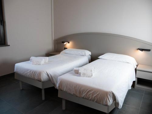Postel nebo postele na pokoji v ubytování Aldero Hotel