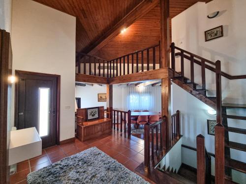 a living room with a spiral staircase in a house at Casa Cogumelo Beachfront Retreat in Viana do Castelo