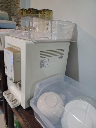 a white sewing machine sitting on top of a table at Jack's house Thara in Krabi town