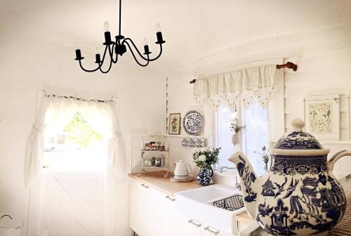 a kitchen with a large blue and white vase at The Old Bakery in Historic Kangaroo Valley Village in Kangaroo Valley