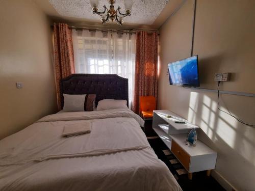 Postel nebo postele na pokoji v ubytování Traveler's Staycation-15 minutes to Westlands