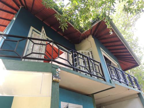a balcony on the side of a house at The Residence Bentota in Bentota