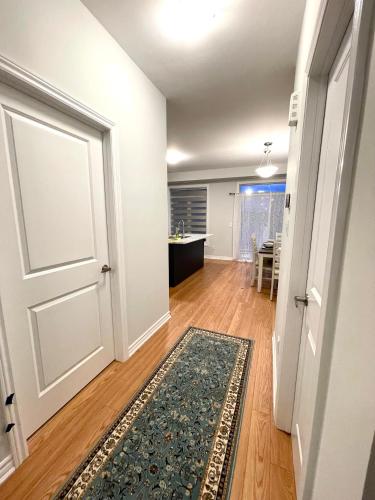 an empty room with a door and a rug at Best home in Oshawa in Oshawa