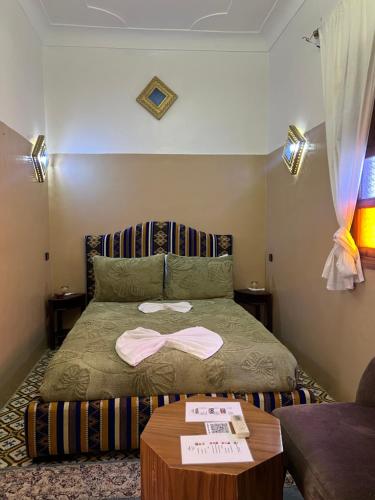 Postel nebo postele na pokoji v ubytování Riad La Perla Bianca