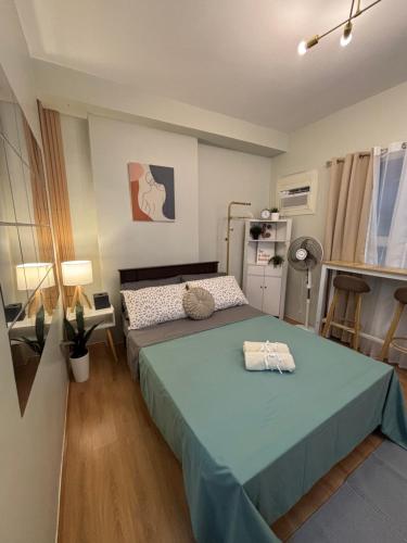 Ένα ή περισσότερα κρεβάτια σε δωμάτιο στο MYS Haven at Mivesa Garden Residences