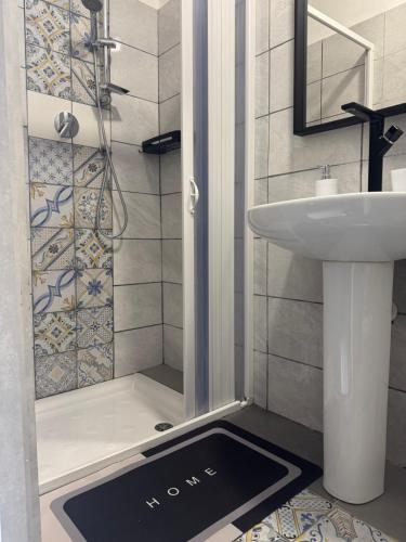 a bathroom with a shower and a sink at Civico 19 Guest House -Free Wi-Fi- in Salerno
