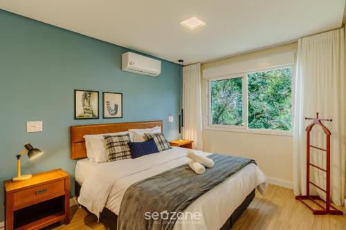 Postel nebo postele na pokoji v ubytování Apartamento c/ 2 Suítes e Churrasqueira MDE0406