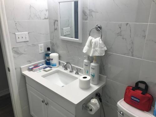 a bathroom with a sink and a mirror at Dont Get Stucked In Boston Traffic in New Bedford