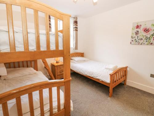 Postel nebo postele na pokoji v ubytování Durham Cottage