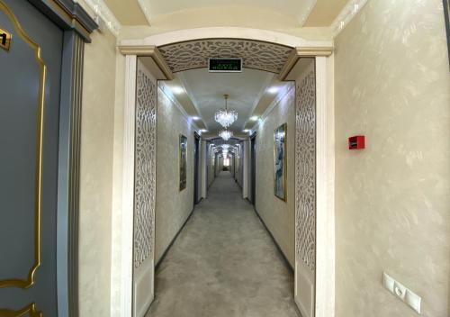 a corridor of a building with at Diyor Hotel in Margilan