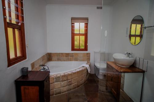 Ένα μπάνιο στο Aan de Heuvel Self-Catering Cottages