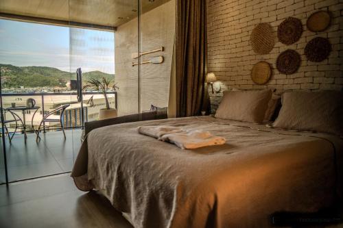 Una cama o camas en una habitación de Cantinho dos Anjos LOFT