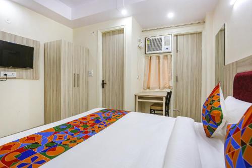 Katil atau katil-katil dalam bilik di FabHotel Taugan Inn - Nr Yashobhoomi Convention Centre