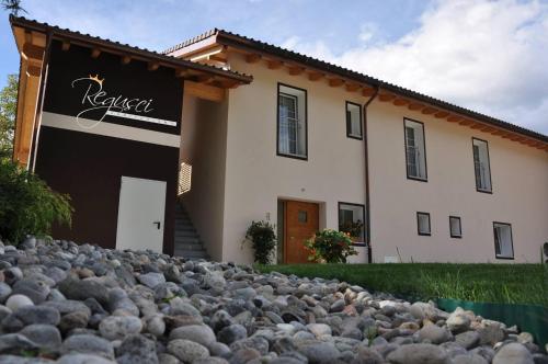 a large pile of rocks in front of a house at Agriturismo Regusci in Camorino