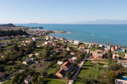 an aerial view of a town next to the water at SERENGETI NAP comfy rooms in Sidari