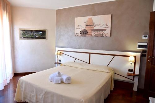 Postel nebo postele na pokoji v ubytování Hotel Sirio