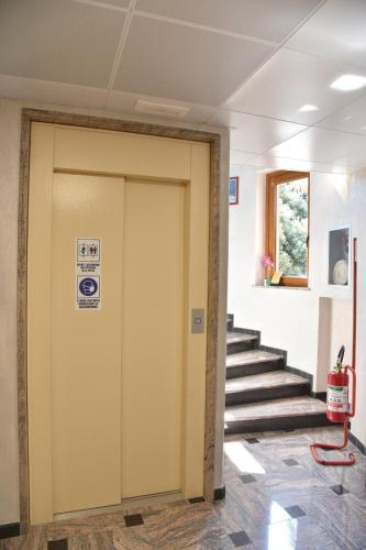 a door in a building with a sign on it at Hotel Sirio in Rotonda
