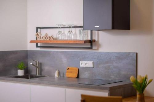 Kuchyň nebo kuchyňský kout v ubytování Apartmán v resortu u Špindlerova Mlýna s wellness