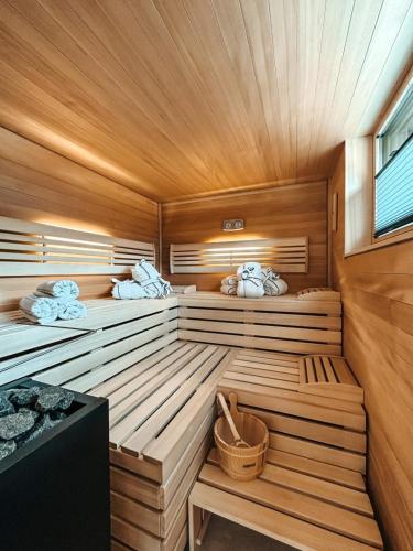 a sauna with two beds in a wooden room at ZSAM Chalets mit Sauna und Hottub in Garmisch-Partenkirchen