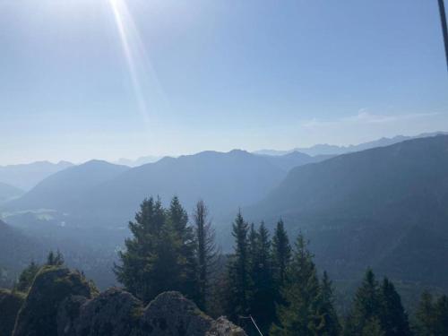 a view of a valley with trees and mountains at Wetzstoa Chalet in Unterammergau mit Sauna und Whirlpool in Unterammergau