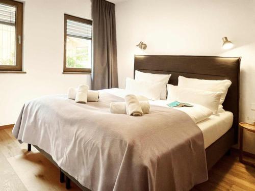 Postel nebo postele na pokoji v ubytování Ferienwohnung h9 Tal mit Sauna und Bergblick