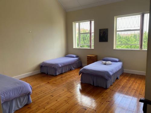 Ένα ή περισσότερα κρεβάτια σε δωμάτιο στο St Luke's Retreat Centre and Guest House