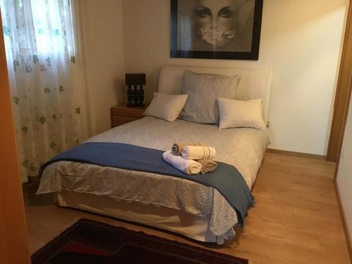 a bedroom with a bed with a stuffed animal on it at Salzkammergut, a place to enjoy in Traunkirchen