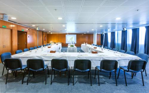 a large conference room with a large table and chairs at El Mouradi Hotel Africa Tunis in Tunis