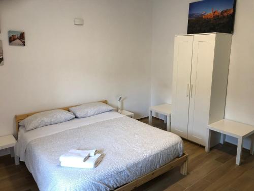 Postel nebo postele na pokoji v ubytování La Dimora di Piccianello 16B