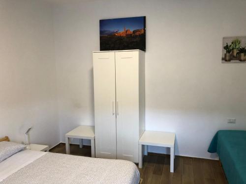 Postel nebo postele na pokoji v ubytování La Dimora di Piccianello 16B