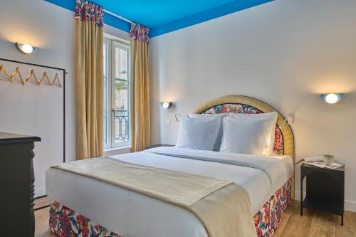 Maleyssie Les Suitesにあるベッド