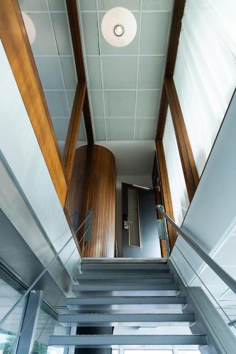 a staircase in a building with a glass ceiling at SWEETS - Oosterdoksdraaibrug in Amsterdam
