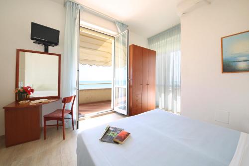 Postel nebo postele na pokoji v ubytování Hotel Caravel