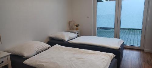 Voodi või voodid majutusasutuse Ferienwohnung Luisa Klein In Aurich Tannenhausen toas