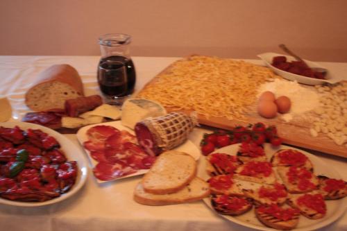 a table with different types of food on it at Country House B&B Antica Dimora Del Sole in Camerota