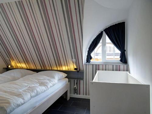 Voodi või voodid majutusasutuse Reethaus Leda In Glowe toas