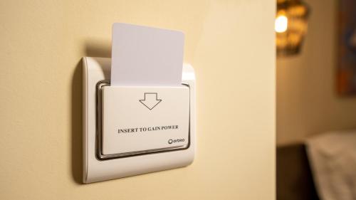 a lightswitch on a wall in a room at CLOUD 5 Blloku Rooms Tirana in Tirana