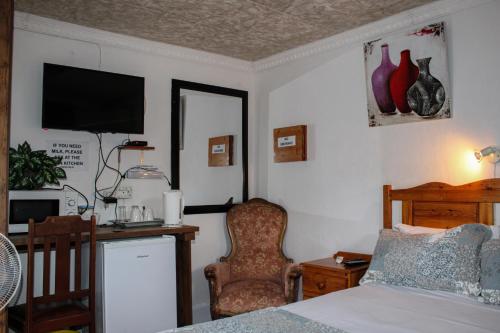 TV a/nebo společenská místnost v ubytování Ebenhaeser guesthouse