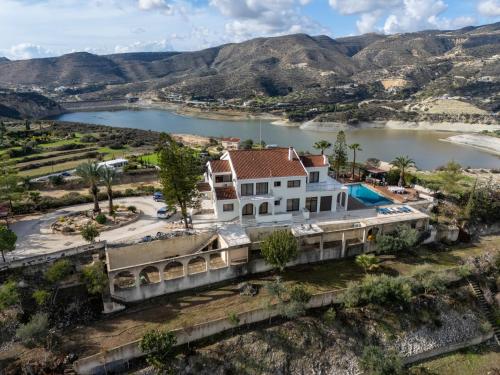 an aerial view of a house next to a lake at Great property - amazing views in Limassol