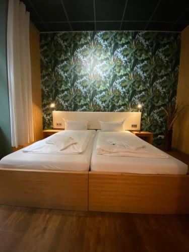 Postel nebo postele na pokoji v ubytování Singer109 Hostel, Hotel & Apartment