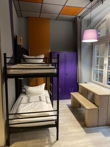 Postel nebo postele na pokoji v ubytování Singer109 Hostel, Hotel & Apartment