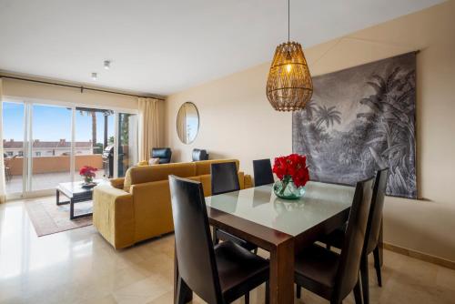 a dining room and living room with a table and chairs at Penthouse with Jacuzzi by Costarentals - Ref 244 in Fuengirola