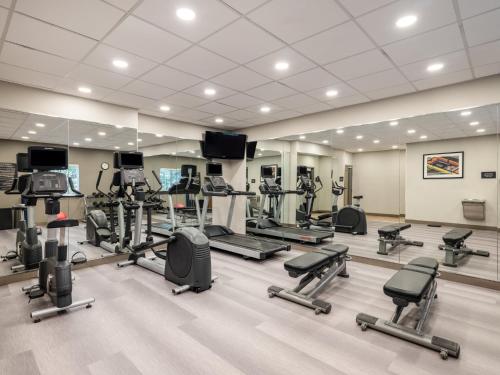 a gym with a lot of treadmills and machines at Candlewood Suites Arundel Mills / BWI Airport by IHG in Hanover
