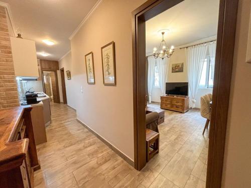 a living room with a large mirror in a room at Dion and Eva's OldTown Apartment in Corfu