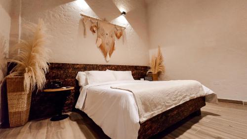 a bedroom with a large bed with a head board at Casa Malva Villas in Buenavista